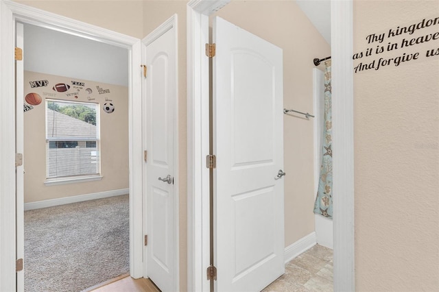 7732 Sloewood Dr, Leesburg, FL 34748 - hall with baseboards and light carpet