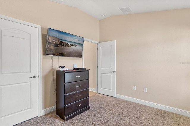 7732 Sloewood Dr, Leesburg, FL 34748 - bedroom with vaulted ceiling and light carpet