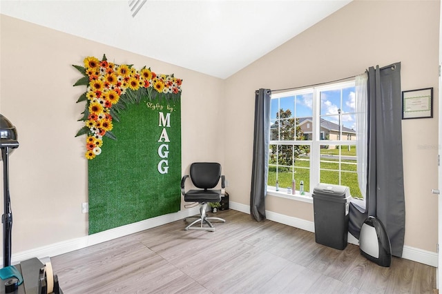 7732 Sloewood Dr, Leesburg, FL 34748 - living area with vaulted ceiling and wood finished floors