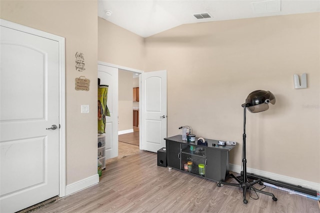 7732 Sloewood Dr, Leesburg, FL 34748 - miscellaneous room with lofted ceiling and wood finished floors