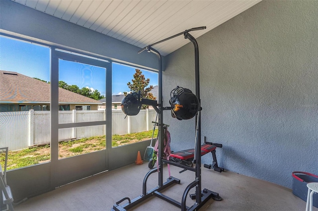 7732 Sloewood Dr, Leesburg, FL 34748 - workout room with a textured wall and plenty of natural light