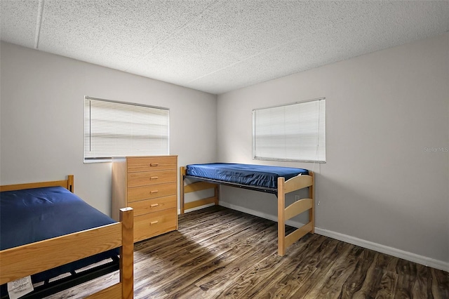 600 W Oak Terrace Dr, Leesburg, FL 34748 - bedroom featuring wood finished floors and a textured ceiling