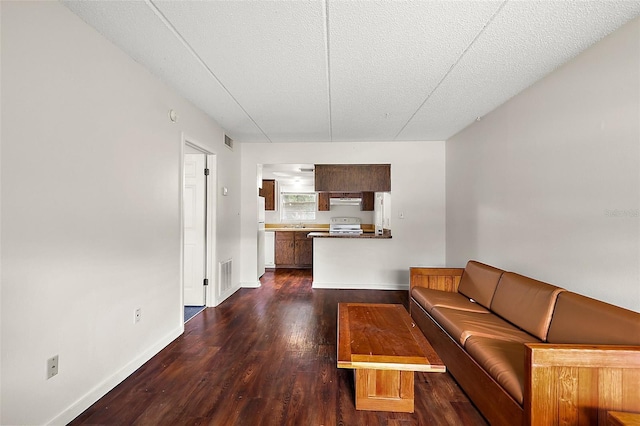 600 W Oak Terrace Dr, Leesburg, FL 34748 - unfurnished living room with dark wood-style flooring and a textured ceiling