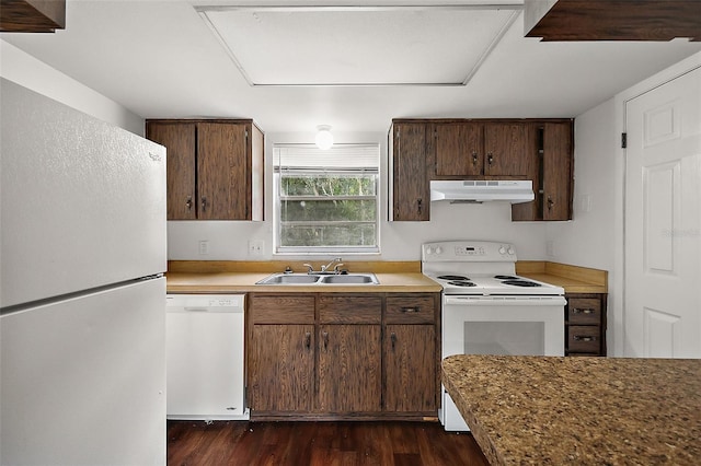 600 W Oak Terrace Dr, Leesburg, FL 34748 - kitchen with white appliances, under cabinet range hood, dark wood finished floors, and light countertops
