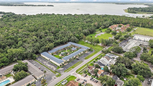 600 W Oak Terrace Dr, Leesburg, FL 34748 - aerial overview of property's location featuring a nearby body of water and a forest