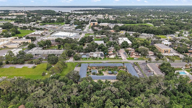 600 W Oak Terrace Dr, Leesburg, FL 34748 - aerial overview of property's location with a nearby body of water and nearby suburban area