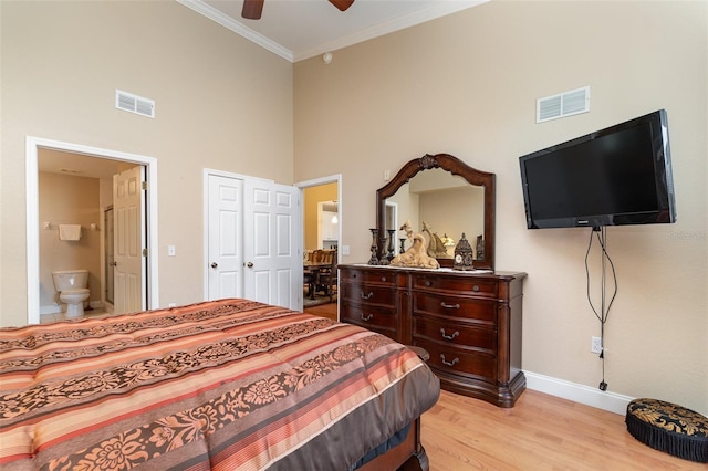 9025 Colby Dr Unit 2121, Fort Myers, FL 33919 - bedroom with a high ceiling, ornamental molding, light wood finished floors, ensuite bathroom, and ceiling fan