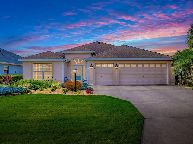 1982 Eldridge Loop, The Villages, FL 32162 - single story home featuring a garage, driveway, stucco siding, a front yard, and roof with shingles