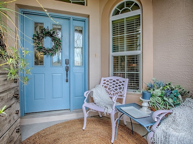 1982 Eldridge Loop, The Villages, FL 32162 - doorway to property featuring stucco siding and covered porch