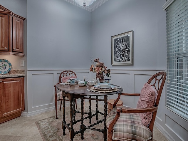 1982 Eldridge Loop, The Villages, FL 32162 - dining area with crown molding, a decorative wall, a wainscoted wall, and light tile patterned flooring