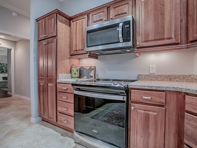 1982 Eldridge Loop, The Villages, FL 32162 - kitchen with appliances with stainless steel finishes, light countertops, brown cabinetry, and crown molding