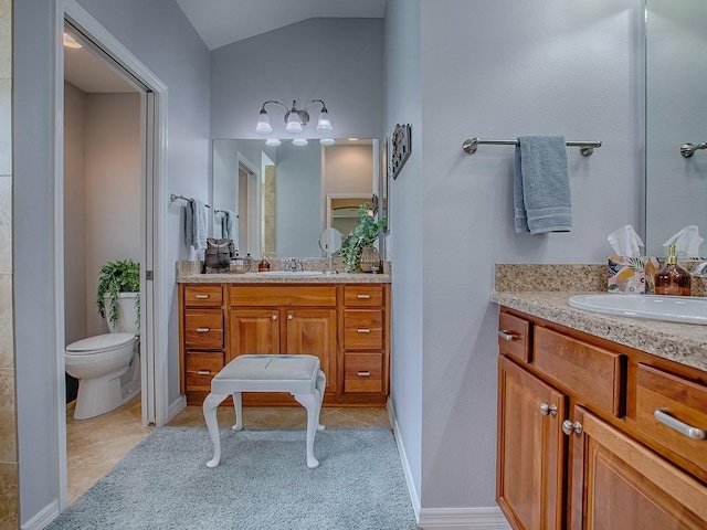 1982 Eldridge Loop, The Villages, FL 32162 - bathroom featuring two vanities and vaulted ceiling