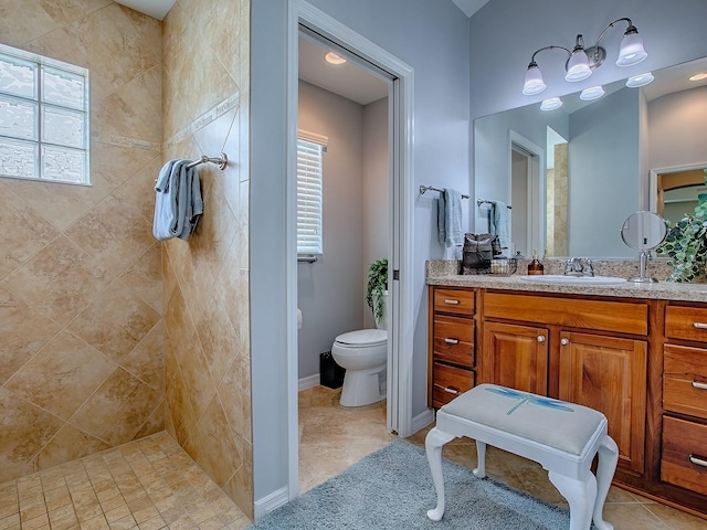 1982 Eldridge Loop, The Villages, FL 32162 - bathroom with vanity, tiled shower, and tile patterned flooring