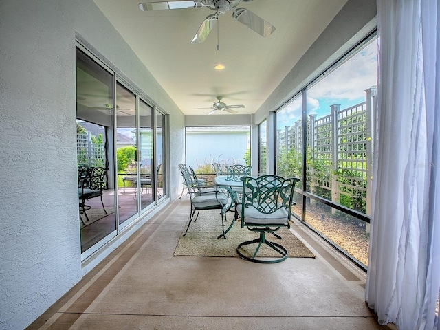 1982 Eldridge Loop, The Villages, FL 32162 - sunroom featuring ceiling fan, healthy amount of natural light, a textured wall, and a city view