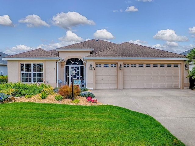 1982 Eldridge Loop, The Villages, FL 32162 - ranch-style home featuring stucco siding, driveway, an attached garage, and a front lawn