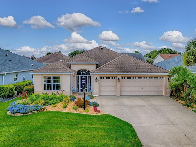 1982 Eldridge Loop, The Villages, FL 32162 - view of front of property featuring a garage, stucco siding, concrete driveway, a front lawn, and roof with shingles