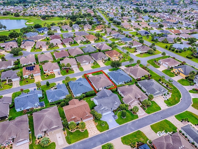 1982 Eldridge Loop, The Villages, FL 32162 - aerial perspective of suburban area with a nearby body of water and property parcel outlined