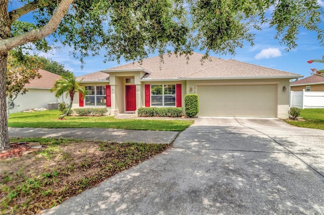 1216 Cheshire St, Groveland, FL 34736 - single story home with driveway, a garage, a front lawn, and stucco siding