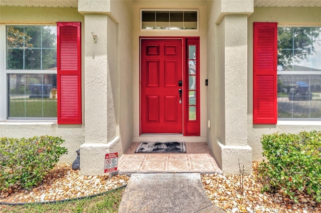 1216 Cheshire St, Groveland, FL 34736 - property entrance with stucco siding