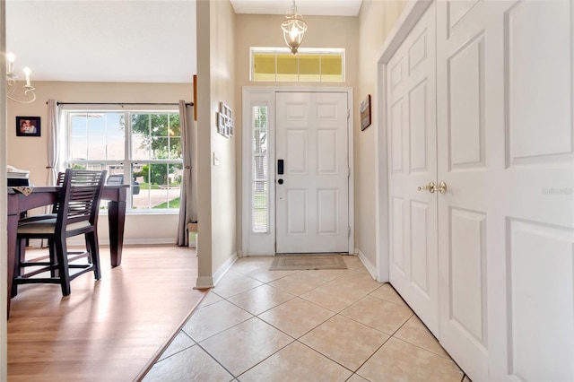 1216 Cheshire St, Groveland, FL 34736 - foyer entrance with baseboards and light tile patterned flooring