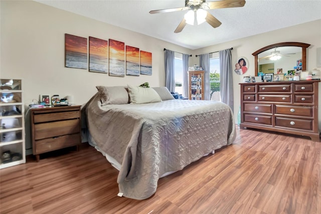 1216 Cheshire St, Groveland, FL 34736 - bedroom with light wood-style flooring and ceiling fan