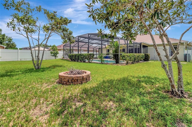 1216 Cheshire St, Groveland, FL 34736 - fenced backyard with an outdoor fire pit