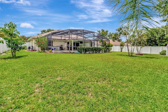 1216 Cheshire St, Groveland, FL 34736 - fenced backyard featuring glass enclosure