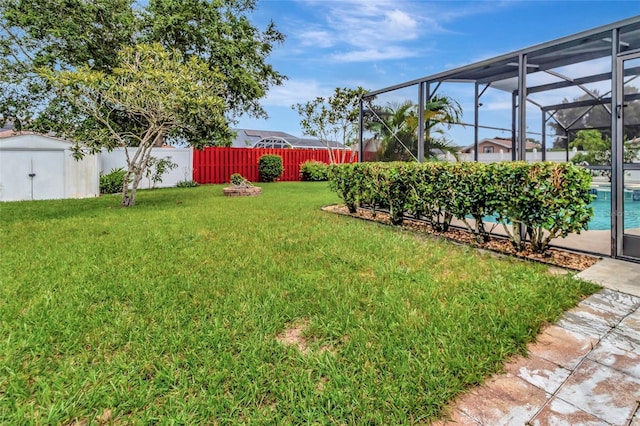 1216 Cheshire St, Groveland, FL 34736 - fenced backyard featuring a shed and glass enclosure