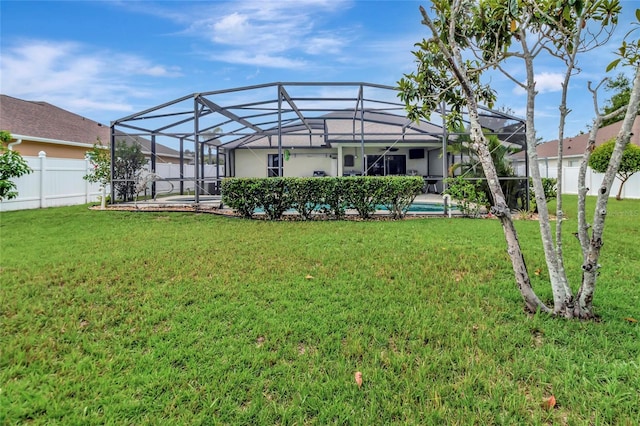 1216 Cheshire St, Groveland, FL 34736 - back of property with a fenced backyard and a lanai