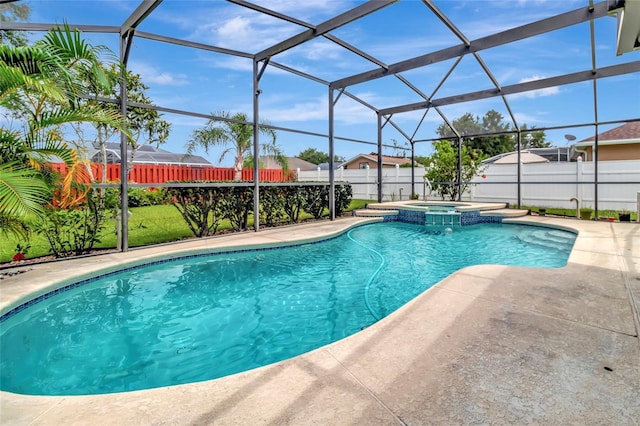 1216 Cheshire St, Groveland, FL 34736 - view of swimming pool with a fenced backyard, a patio area, a pool with connected hot tub, and glass enclosure
