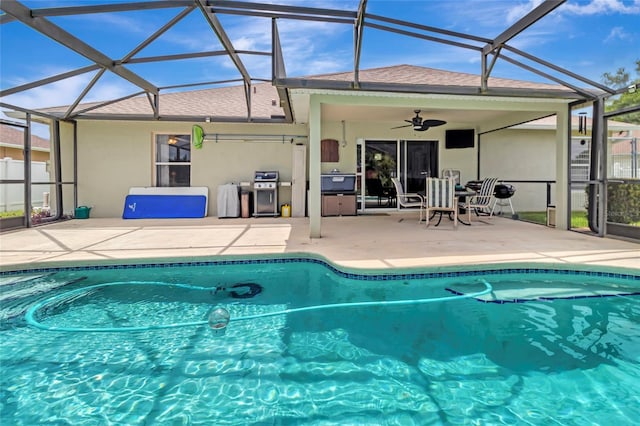 1216 Cheshire St, Groveland, FL 34736 - outdoor pool featuring a ceiling fan, a patio, and glass enclosure