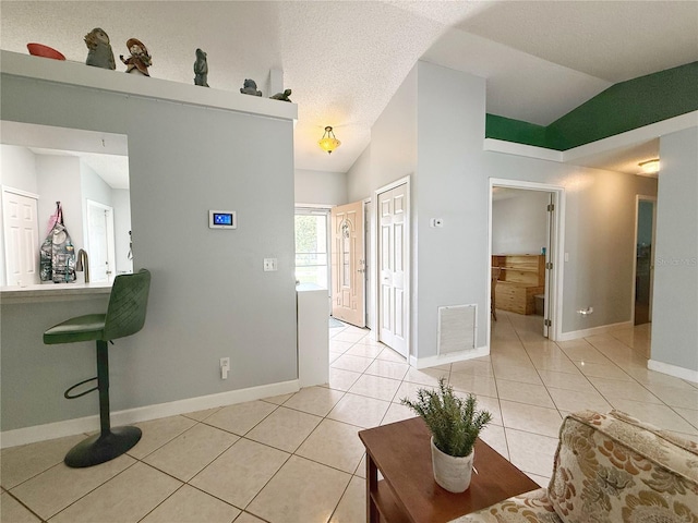 15349 Lafite Ln, Clermont, FL 34714 - living area featuring vaulted ceiling and light tile patterned floors