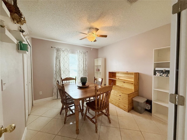 15349 Lafite Ln, Clermont, FL 34714 - dining room featuring ceiling fan, light tile patterned floors, and a textured ceiling