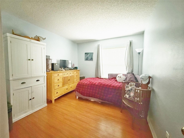 15349 Lafite Ln, Clermont, FL 34714 - bedroom featuring light wood-style flooring and a textured ceiling
