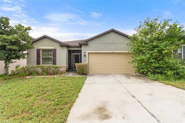 120 Citrus Isle St, Davenport, FL 33837 - ranch-style home featuring stucco siding, an attached garage, concrete driveway, and a front yard