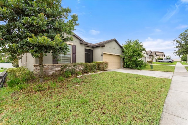 120 Citrus Isle St, Davenport, FL 33837 - view of front facade with driveway, stucco siding, an attached garage, a front yard, and stone siding