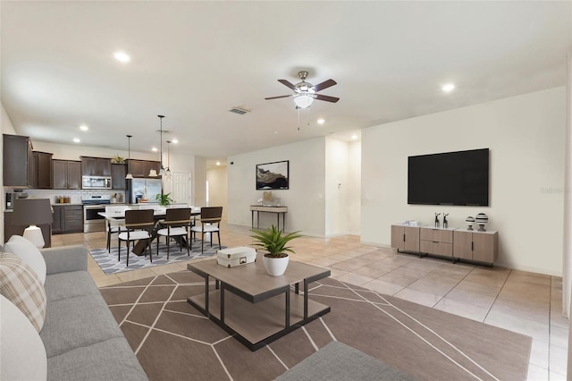 120 Citrus Isle St, Davenport, FL 33837 - living area featuring light tile patterned flooring, recessed lighting, and a ceiling fan