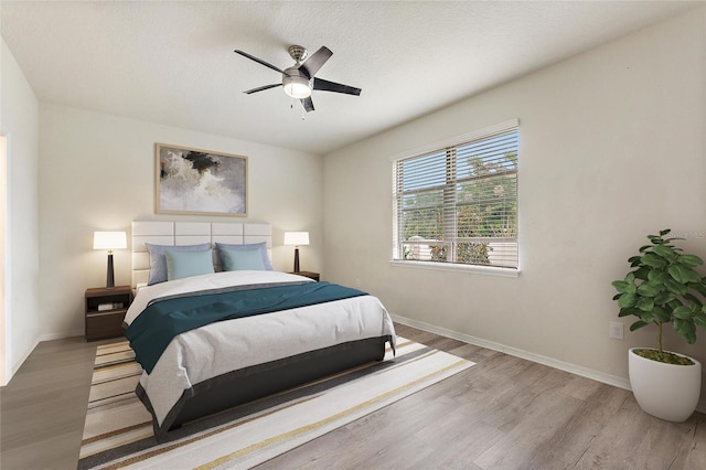 120 Citrus Isle St, Davenport, FL 33837 - bedroom with wood finished floors and a ceiling fan