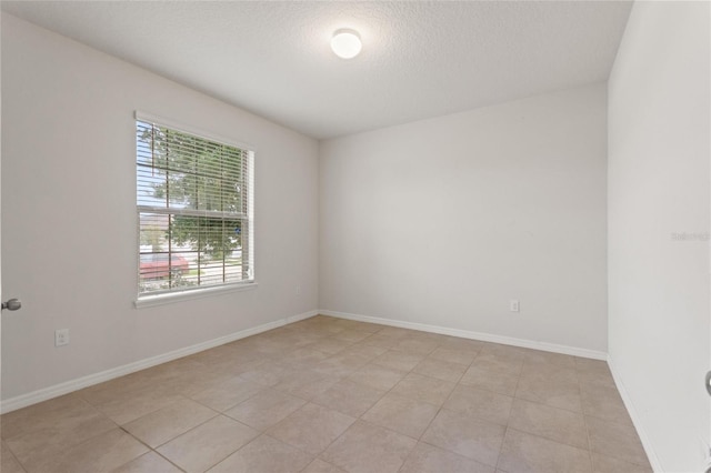120 Citrus Isle St, Davenport, FL 33837 - unfurnished room featuring a textured ceiling and light tile patterned floors