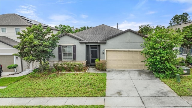 120 Citrus Isle St, Davenport, FL 33837 - view of front of house with stucco siding, a garage, driveway, a front lawn, and a shingled roof