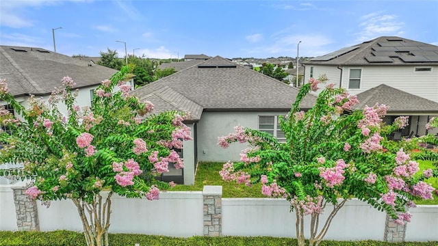 120 Citrus Isle St, Davenport, FL 33837 - view of front of house with roof with shingles and stucco siding