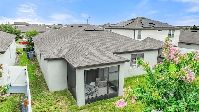 120 Citrus Isle St, Davenport, FL 33837 - back of house featuring a gate, stucco siding, and a fenced backyard