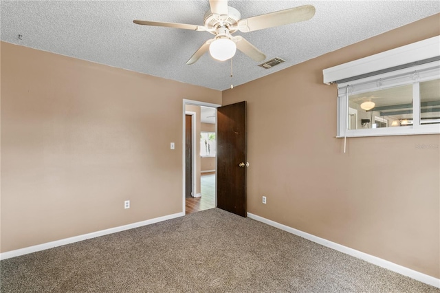 461 Kee St, Apopka, FL 32712 - unfurnished room featuring a ceiling fan, a textured ceiling, and carpet flooring