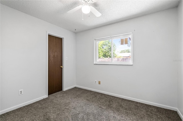 461 Kee St, Apopka, FL 32712 - empty room with dark colored carpet, ceiling fan, and a textured ceiling