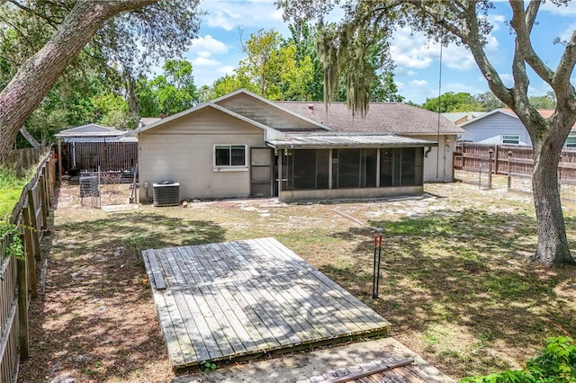 461 Kee St, Apopka, FL 32712 - rear view of house featuring a sunroom, a deck, a fenced backyard, and roof with shingles