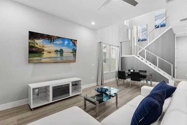 2163 White Feather Loop, Oakland, FL 34787 - living area featuring wood finished floors, stairs, recessed lighting, and a ceiling fan