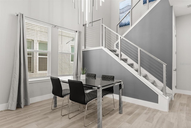 2163 White Feather Loop, Oakland, FL 34787 - dining area with wood finished floors and stairway