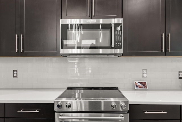 2163 White Feather Loop, Oakland, FL 34787 - kitchen featuring stainless steel appliances, backsplash, and light countertops