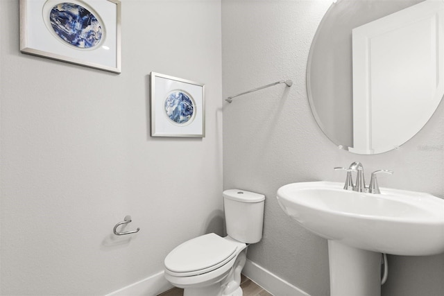 2163 White Feather Loop, Oakland, FL 34787 - half bathroom featuring toilet and wood finished floors