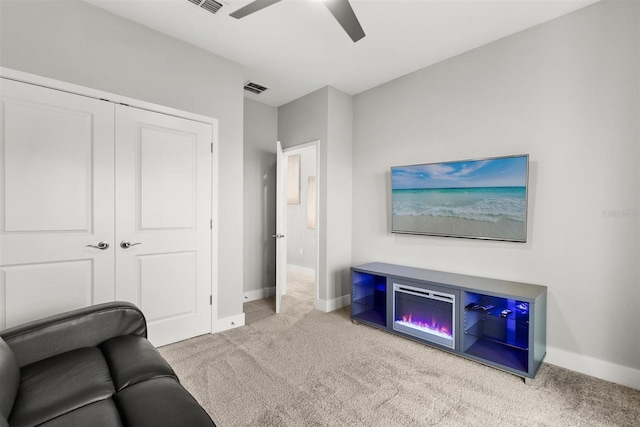 2163 White Feather Loop, Oakland, FL 34787 - carpeted living area with baseboards and ceiling fan